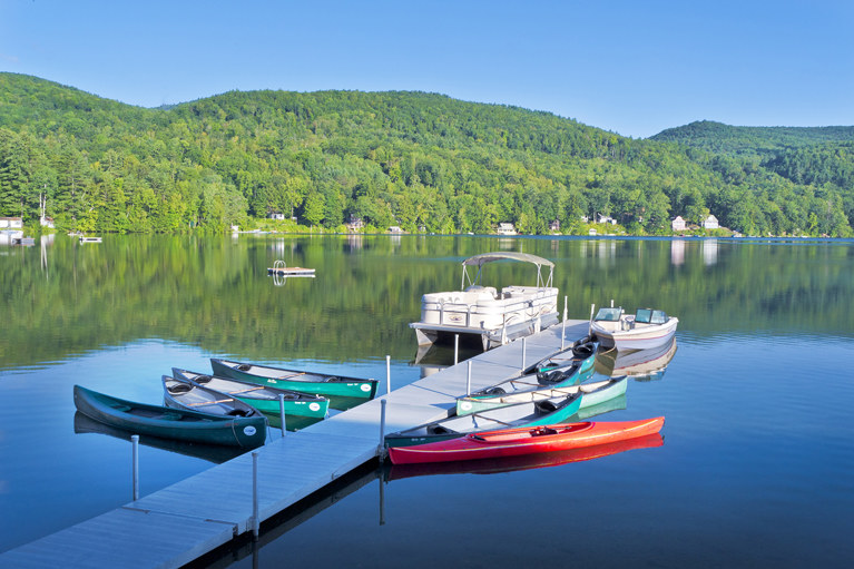 Boats in dock on lake